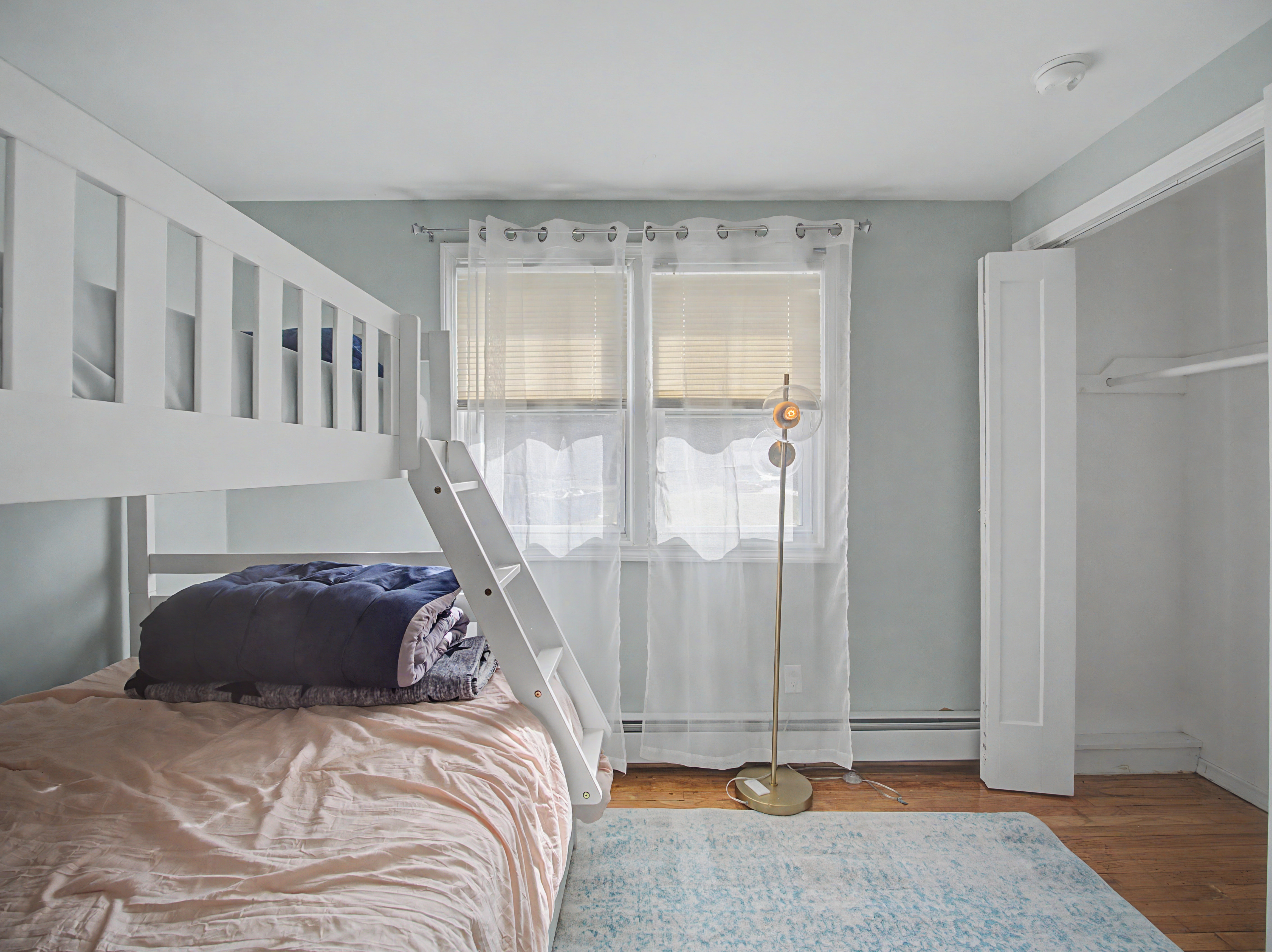Sleeping space in a Connecticut short-term rental, photographed by Ari Lee