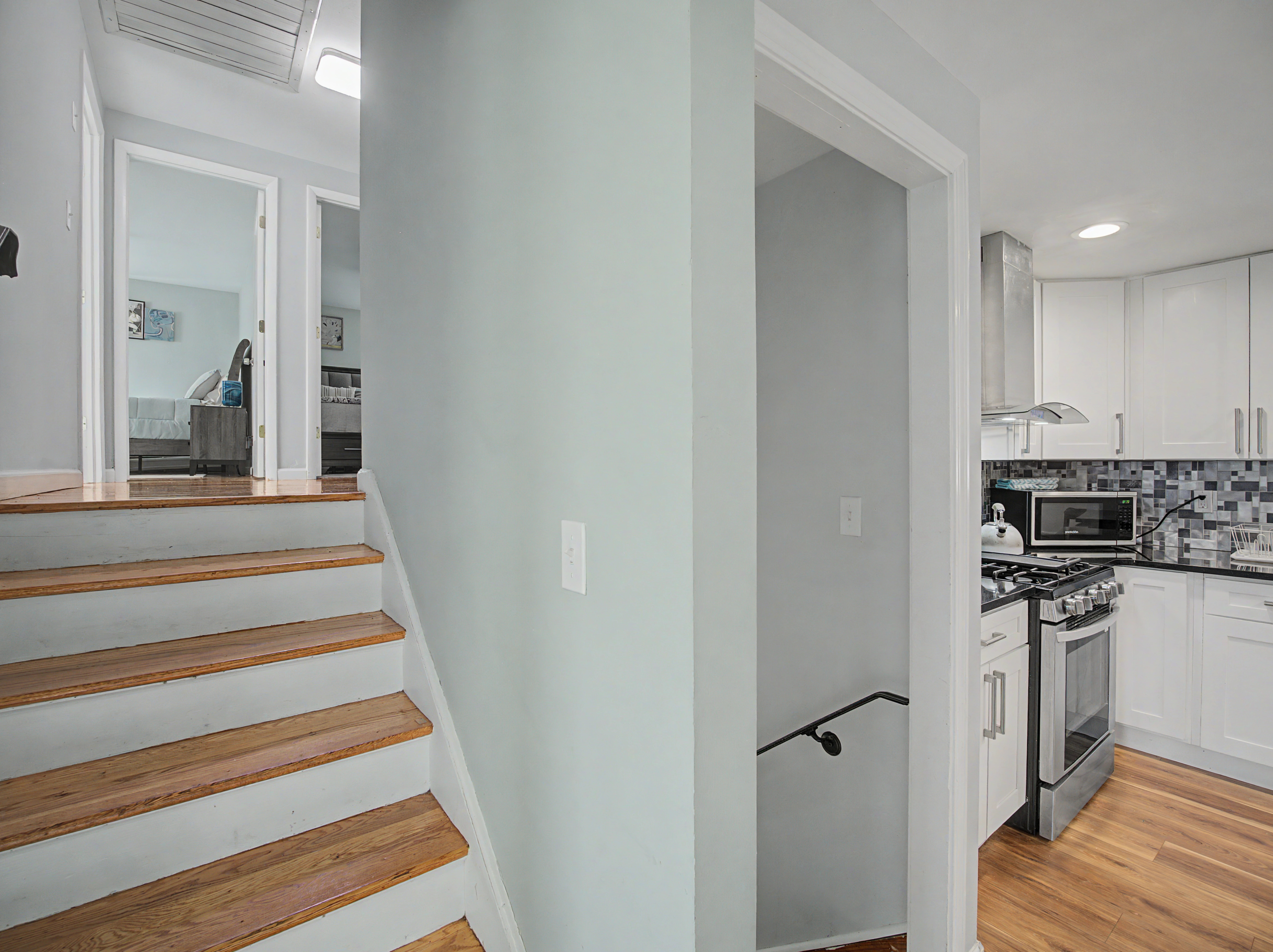 Kitchen and stairway in a Connecticut Airbnb, photographed by Ari Lee
