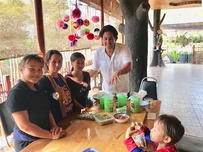 Phil teaching a sprouting workshop to the women at The Wild Flower Home.