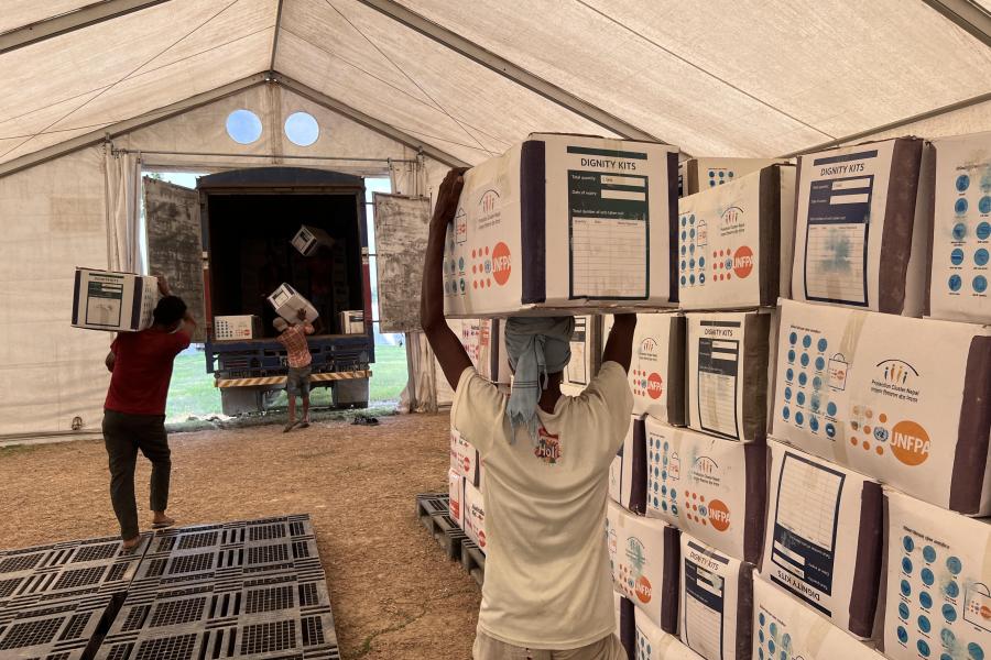 Dignity Kits are dispatched from a humanitarian staging area to flood ...