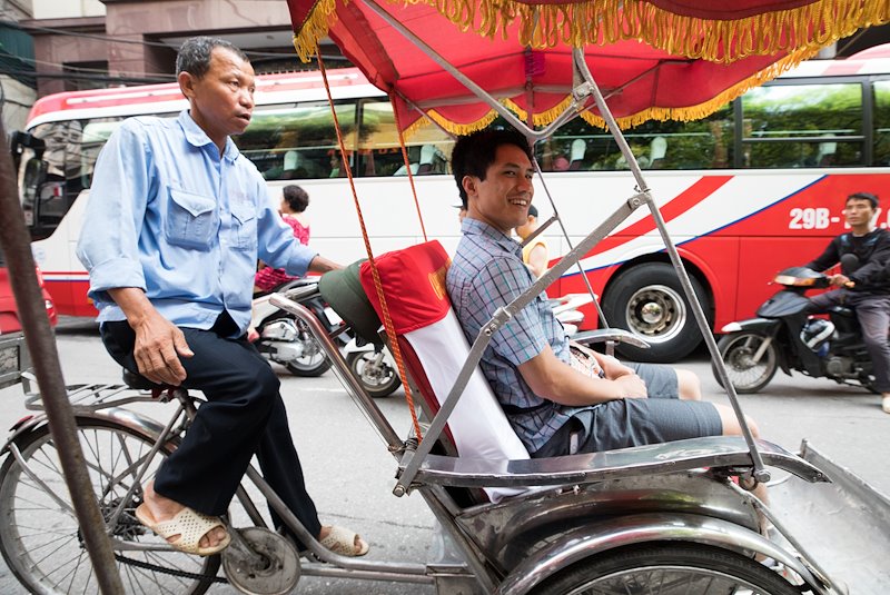 Jonathan Liporada takes a rickshaw tour of downtown Hanoi. Photo by Jaren Wilkey/BYU
