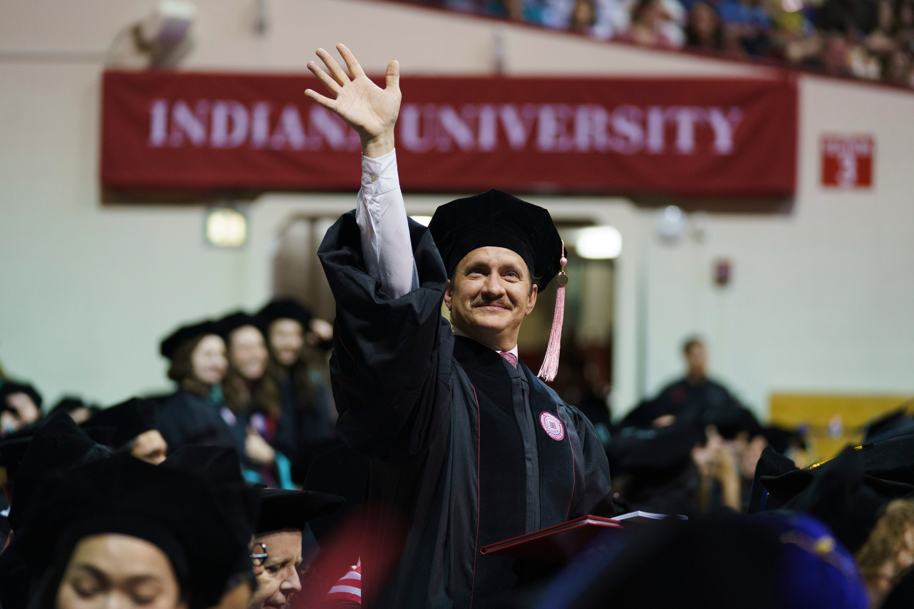 An IU Bloomington Graduate spots his supporters in the crowd during the ...