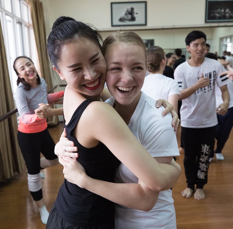Emily Huckstep hugs her dance partner during a dance workshop at the Hanoi Academy of Theatre &amp; Cinema. Photo by Jaren Wilkey/BYU