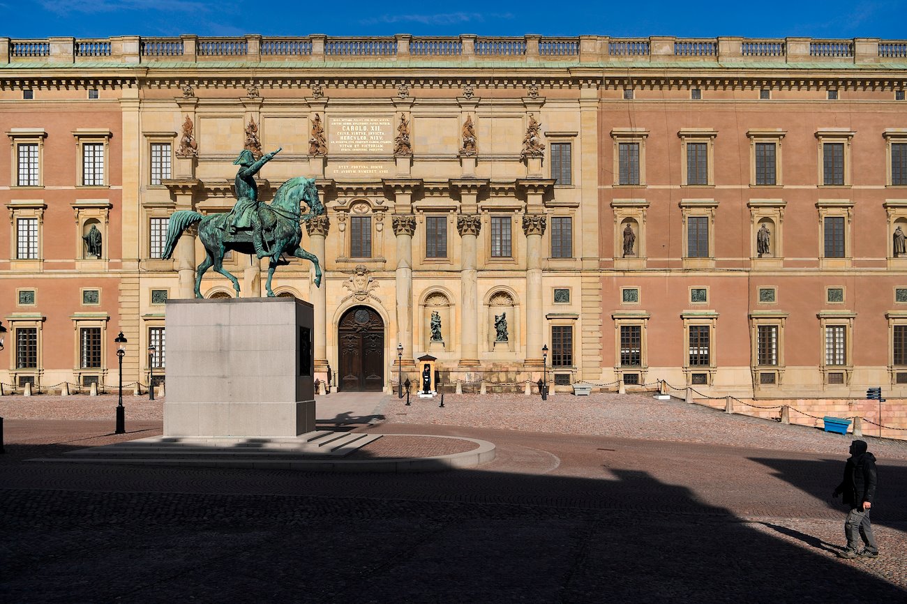 A guard stands at the Royal Palace, an area usually crowded with tourists, in Stockholm, Sweden, on Thursday, March 26, 2020.