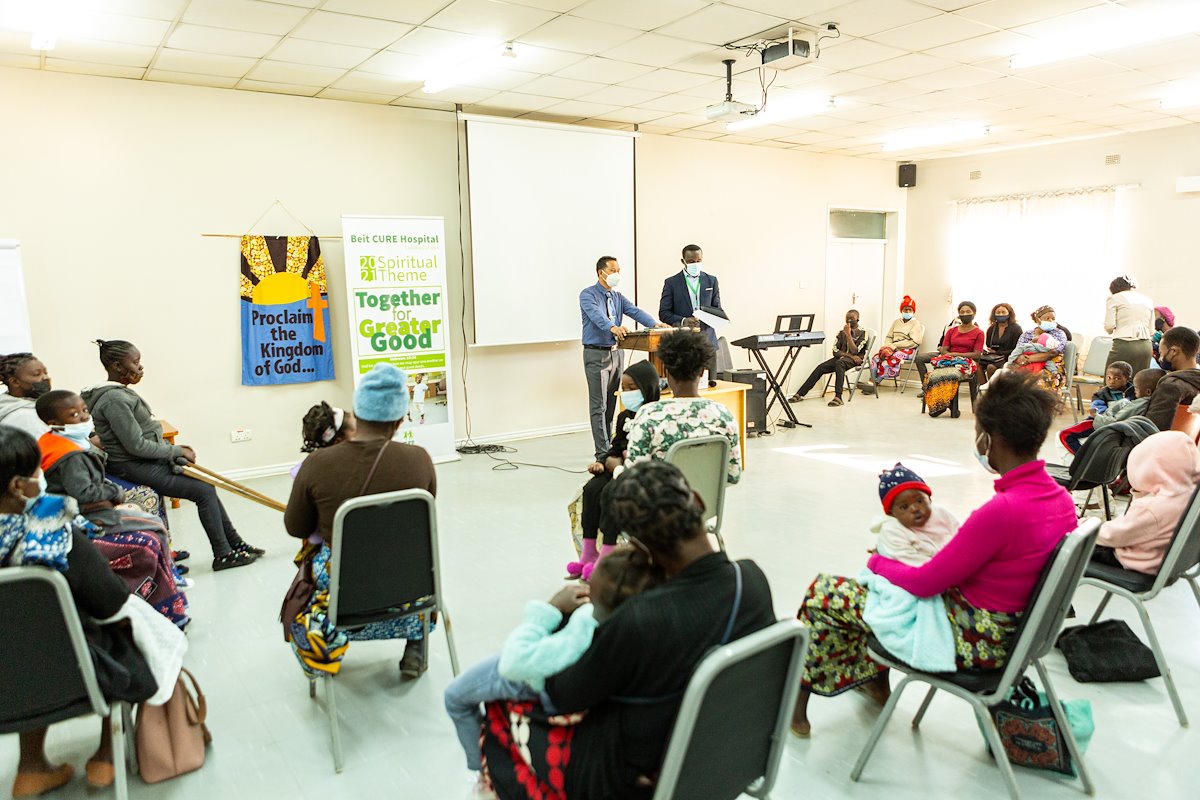 Pastor Terence and Pastor Ricky sharing the word of God to the patients as they wait to go to the out patient department.