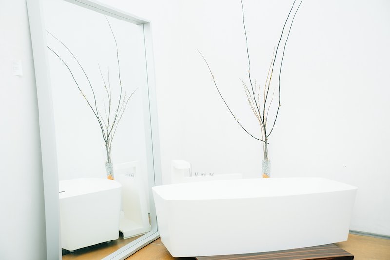 A strategically placed mirror reveals this bath's unique design.