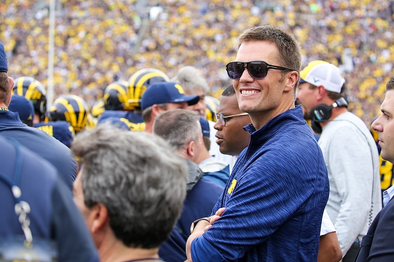 Former Michigan quarterback Tom Brady smiles after being honored at Michigan Stadium.