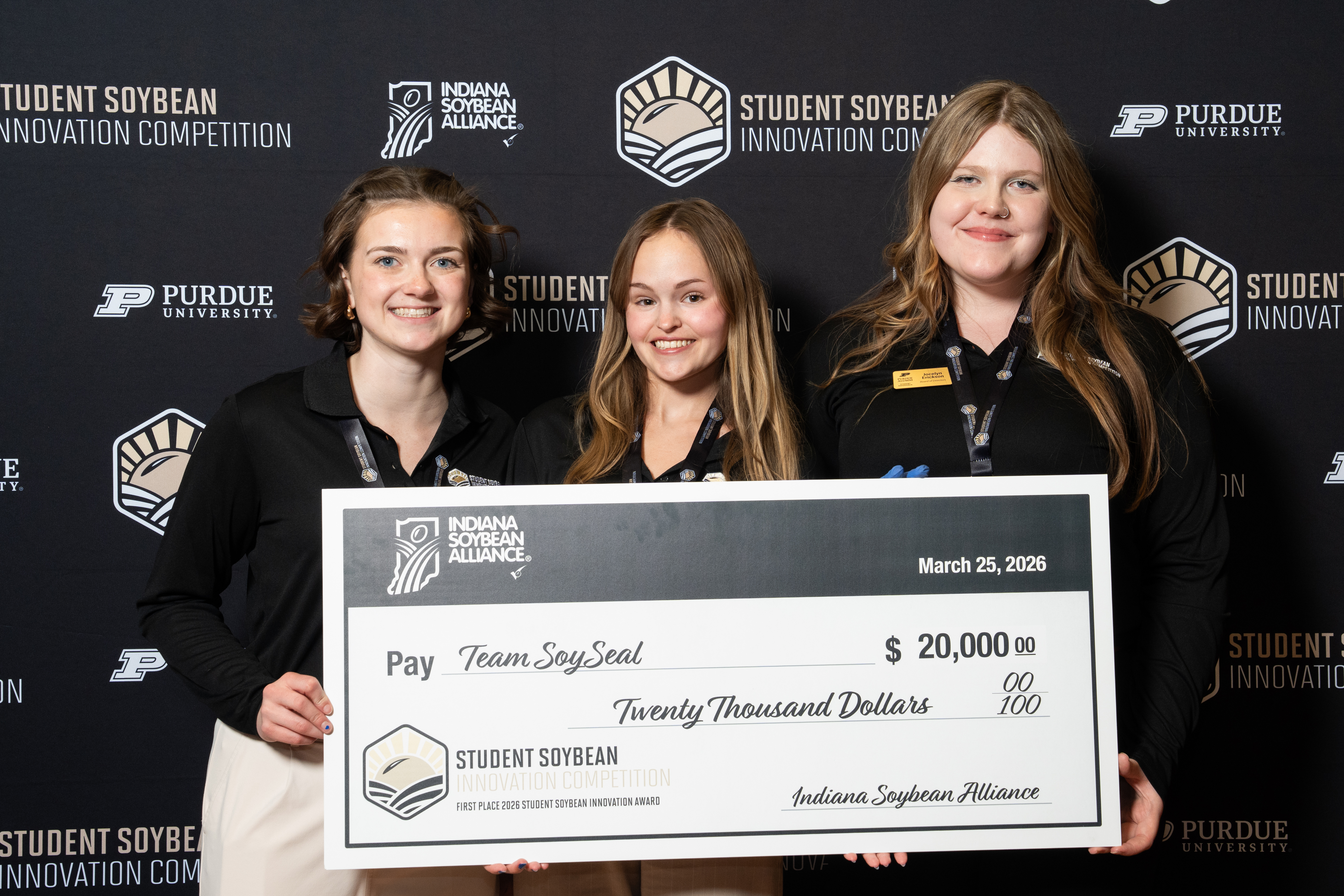 Team Soy Seal, first place winners, holds a $20,000 check from the ...