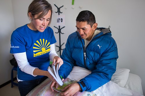 Edson receives a Bible from Barbara Zeidan, a member of our local ministry team.