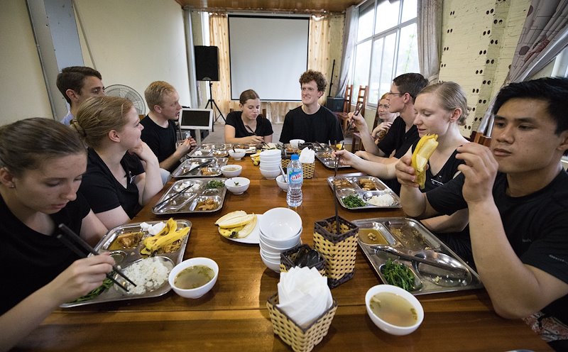 Students eat a pre performance meal at the Vietnam Dance Academy. Photo by Jaren Wilkey/BYU