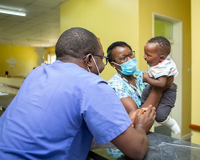 Nurses, Luyando and Mambwe, are having fun with a patient.