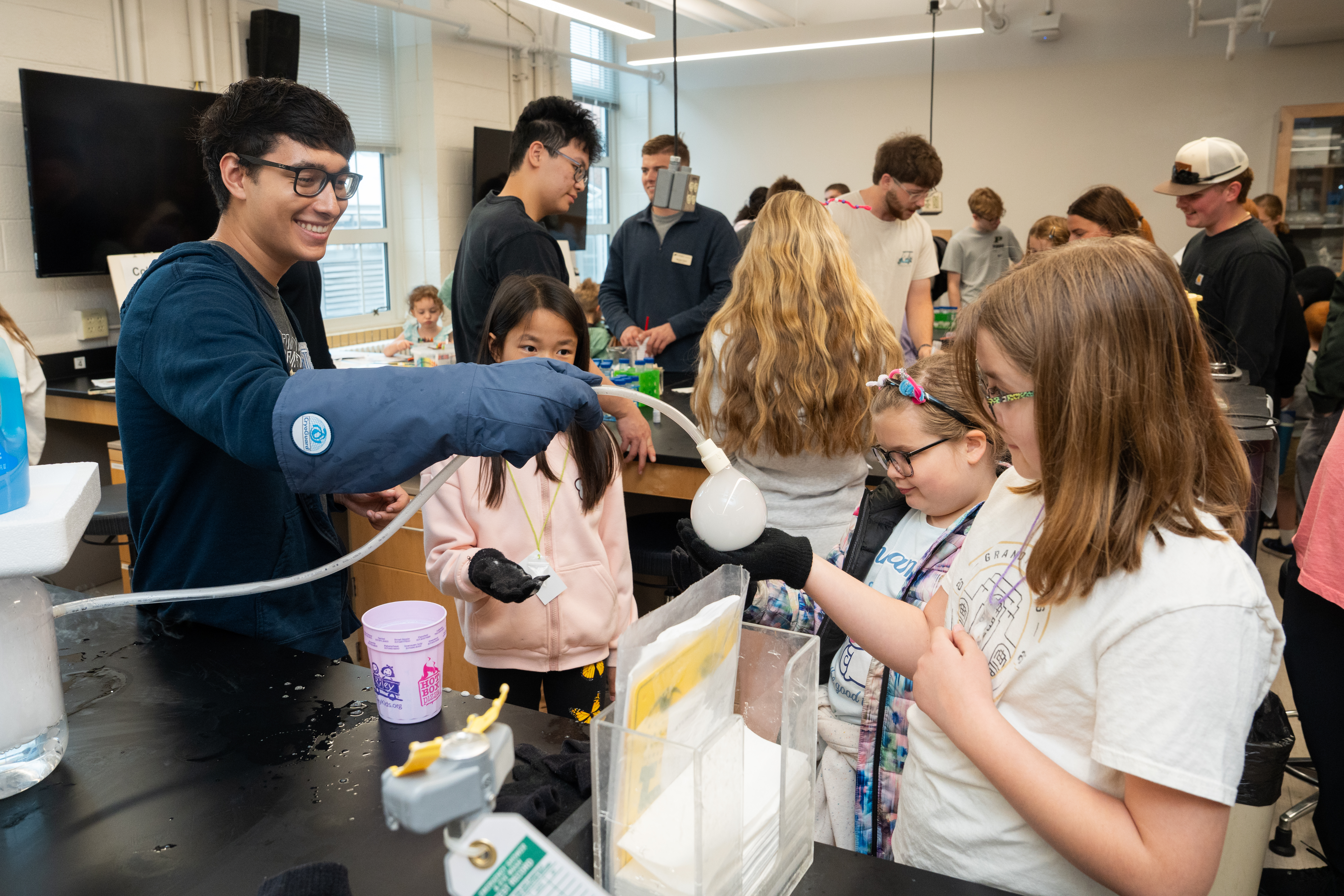 Students participate in a science demonstration at Spring Fest 2026. A ...