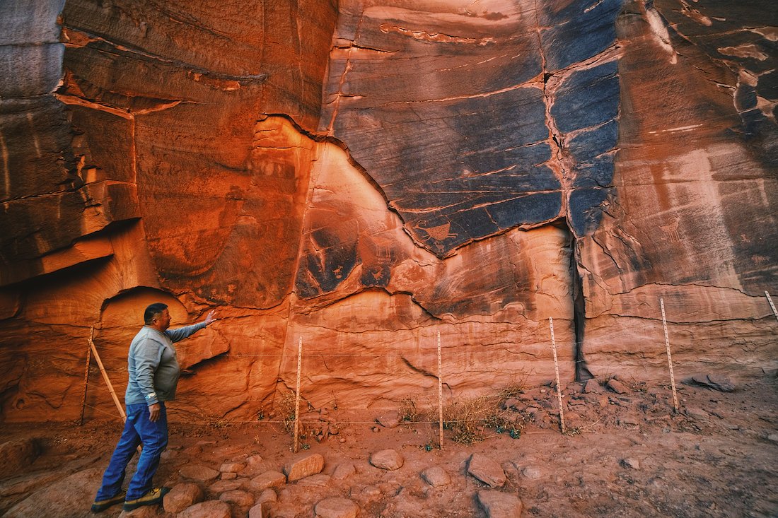 Our guide showing us petroglyphs left by the first human settlers in the valley.