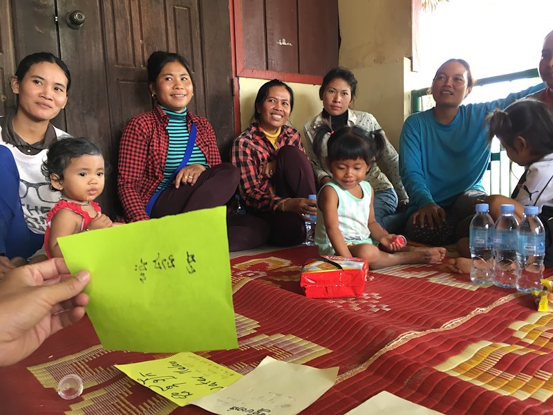 Gardeners in Ballang Mean Chey village gather to discuss how they juggle home gardens with farming and day jobs in the city.