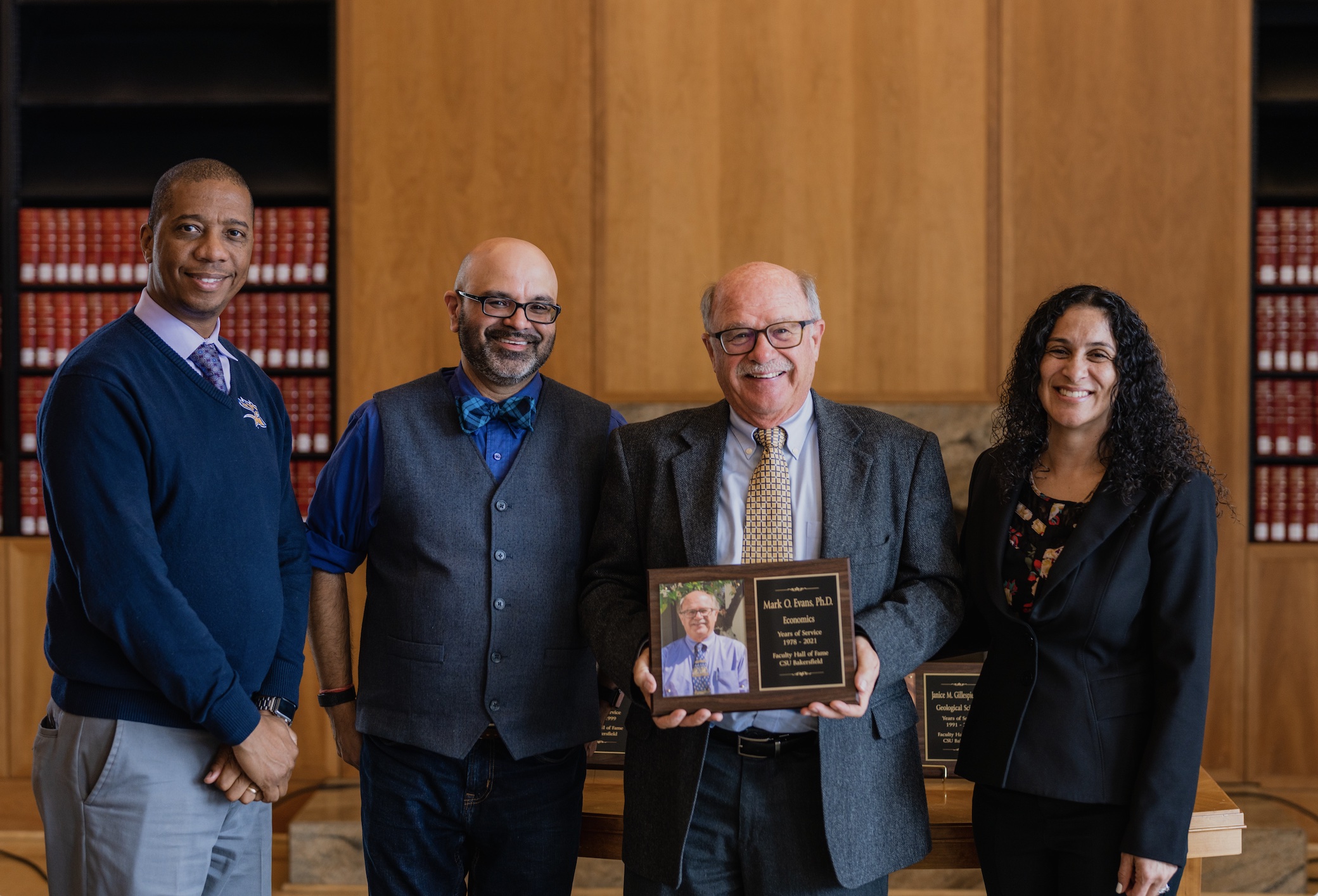 Former Economics Professor Dr. Mark Evans, third from left, was ...