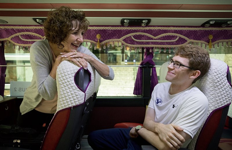 Dixie Barrinton chats with Matthew Baird on the bus. Photo by Jaren Wilkey/BYU