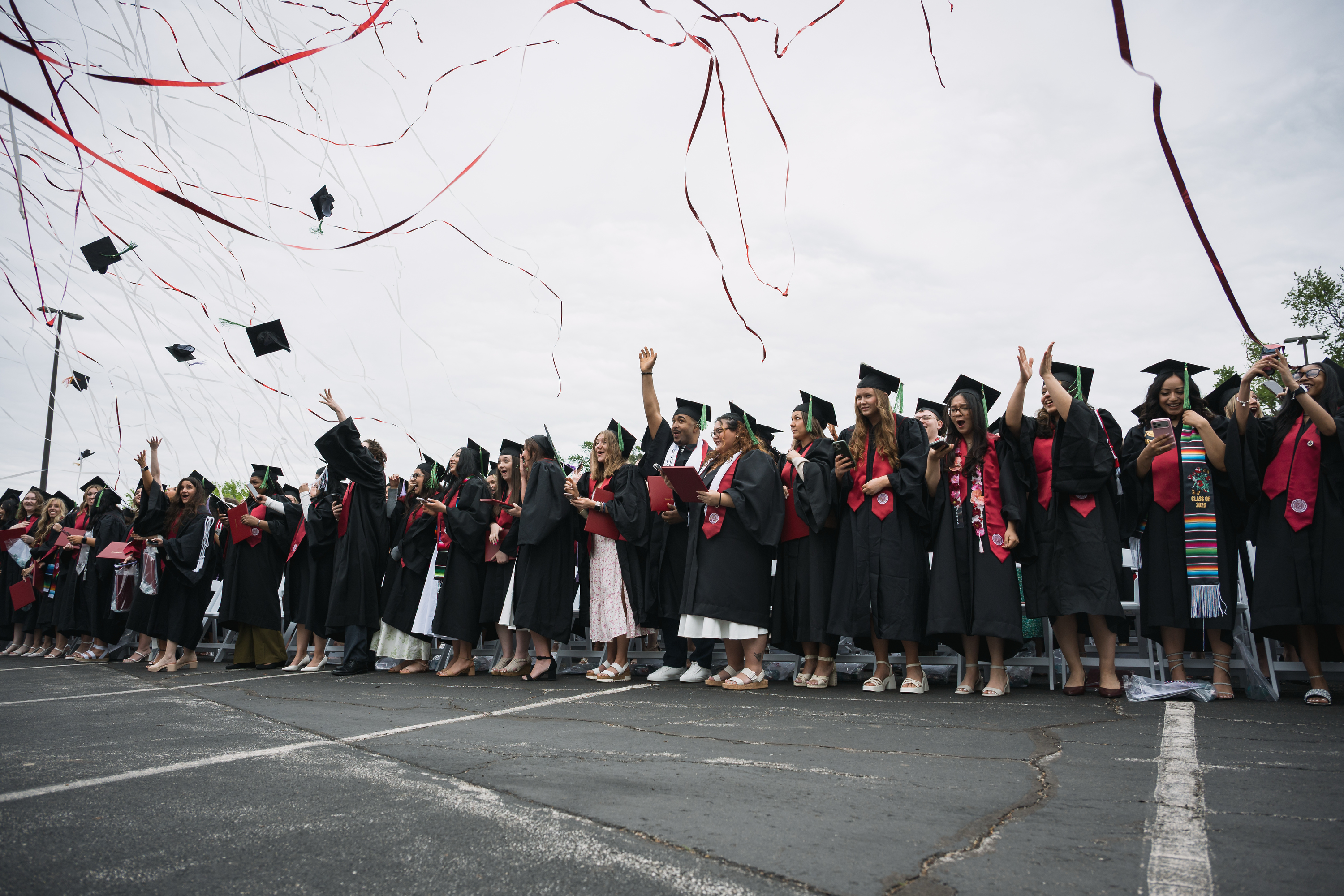 Streamers fall on graduates during the IU Northwest Commencement in ...