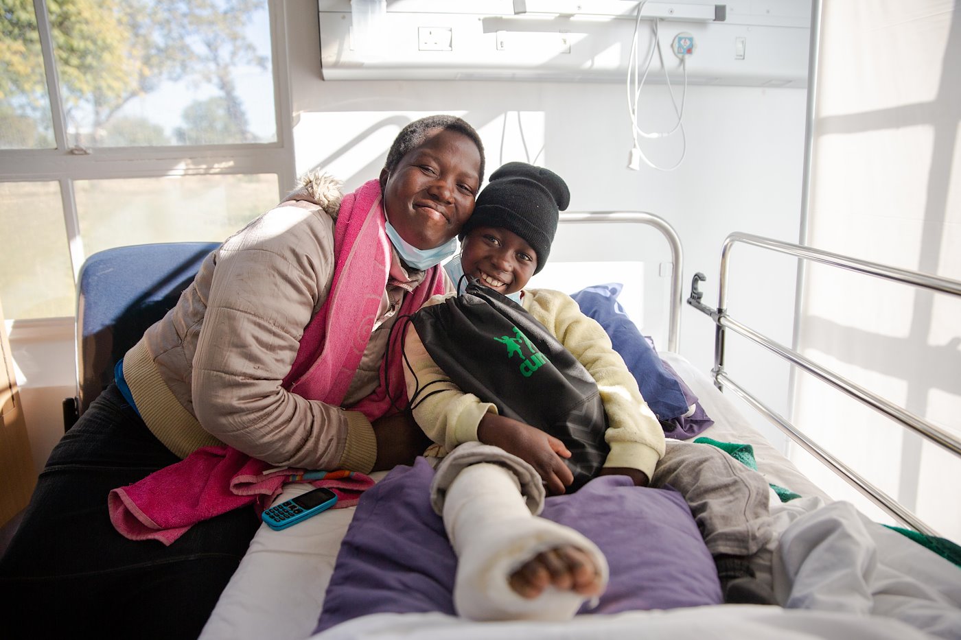 Tamia and her mom are ready to go home for the weekend with her CURE care kit.