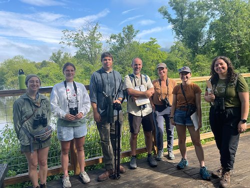 McCullough fellows learn about Nicole Moordian's research while birding.