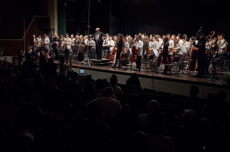 Audience members in Quezon City applaud the combined orchestra. Photo by Jaren Wilkey/BYU