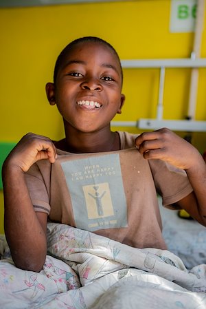 He wants us to read his shirt which says, "When you are happy, I am happy too."