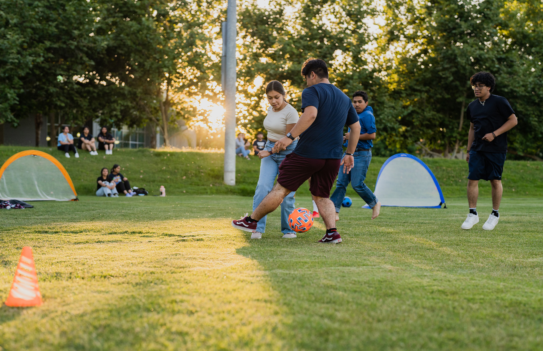 A group of Incoming freshmen play soccer on campus during the Summer ...