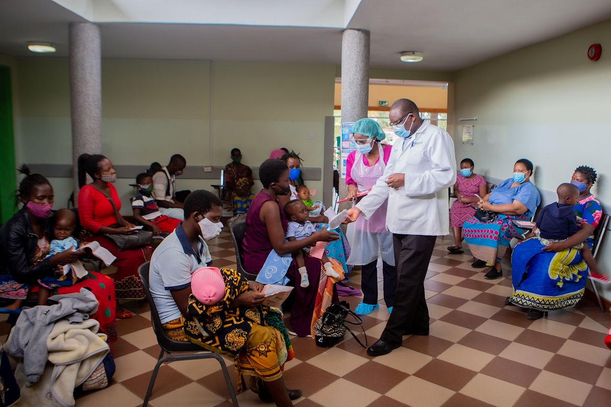 Dr. Maina and a nurse screening patients.