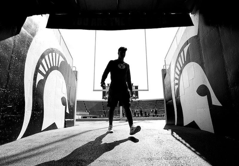 BYU football player enters the tunnel at Spartan Stadium before playing against Michigan State - Photo by Jaren Wilkey/BYU