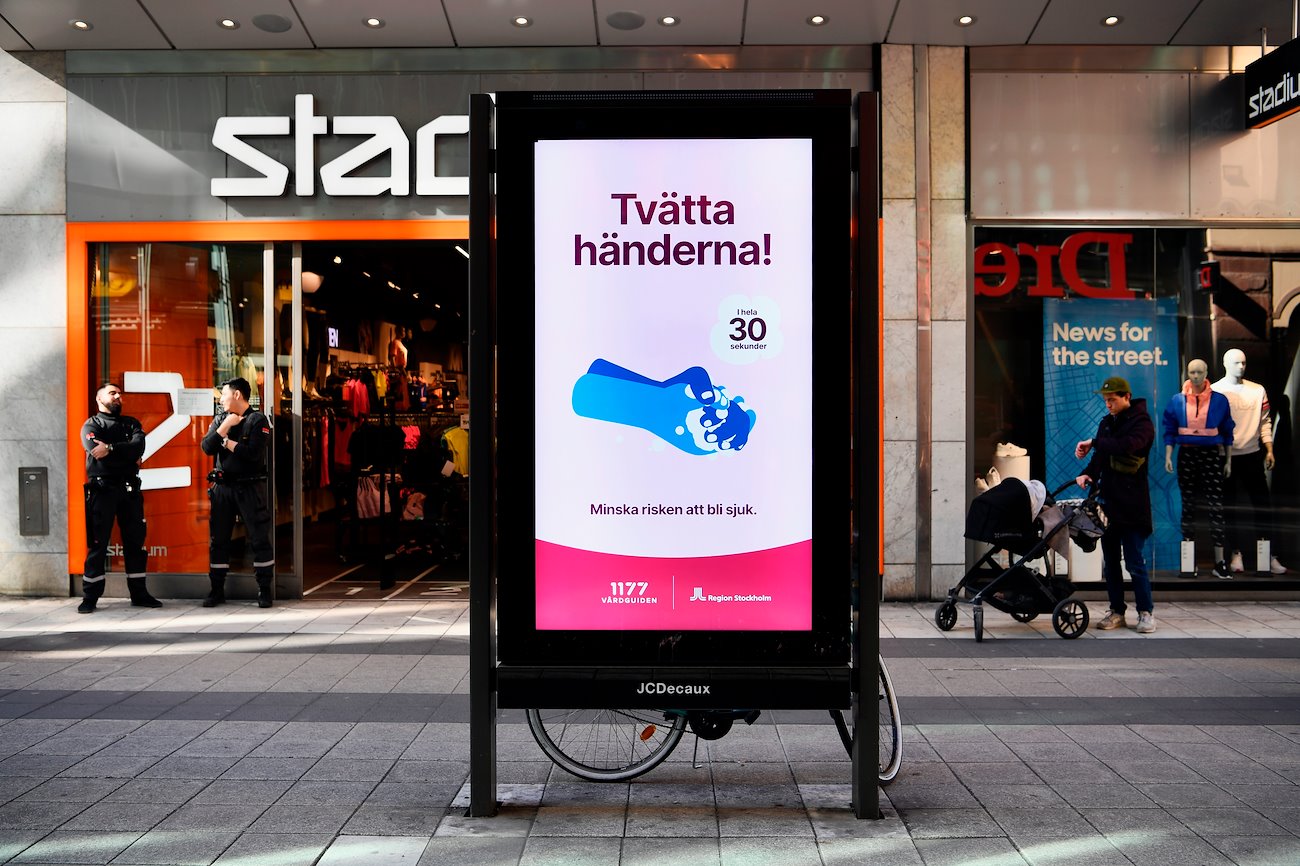 A digital advertisement advises people to wash their hands in Stockholm, Sweden, on Thursday, March 26, 2020.