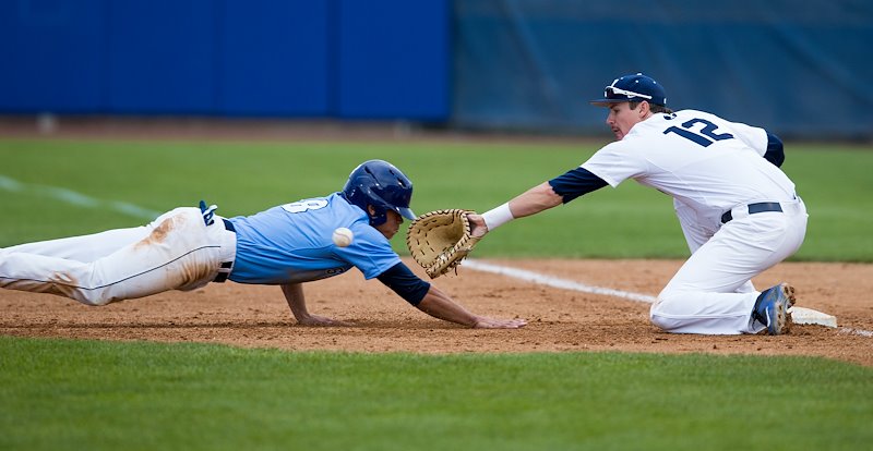 Tanner Chauncey tags a player out during BYU's game against San Diego - Photo by Jaren Wilkey/BYU