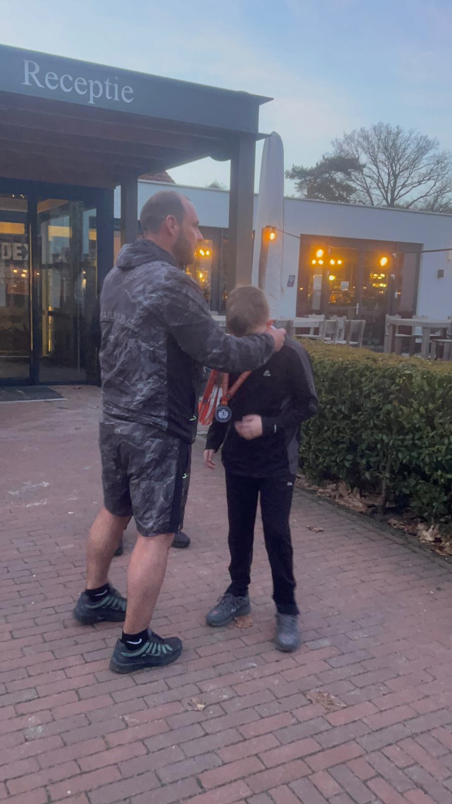 A Fletcher Moss Rangers player receives a medal at the Holland Easter ...