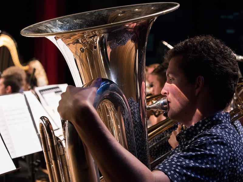 BYU Chamber Orchestra member Nolan Harris playing the tuba. Photo by Jaren Wilkey/BYU