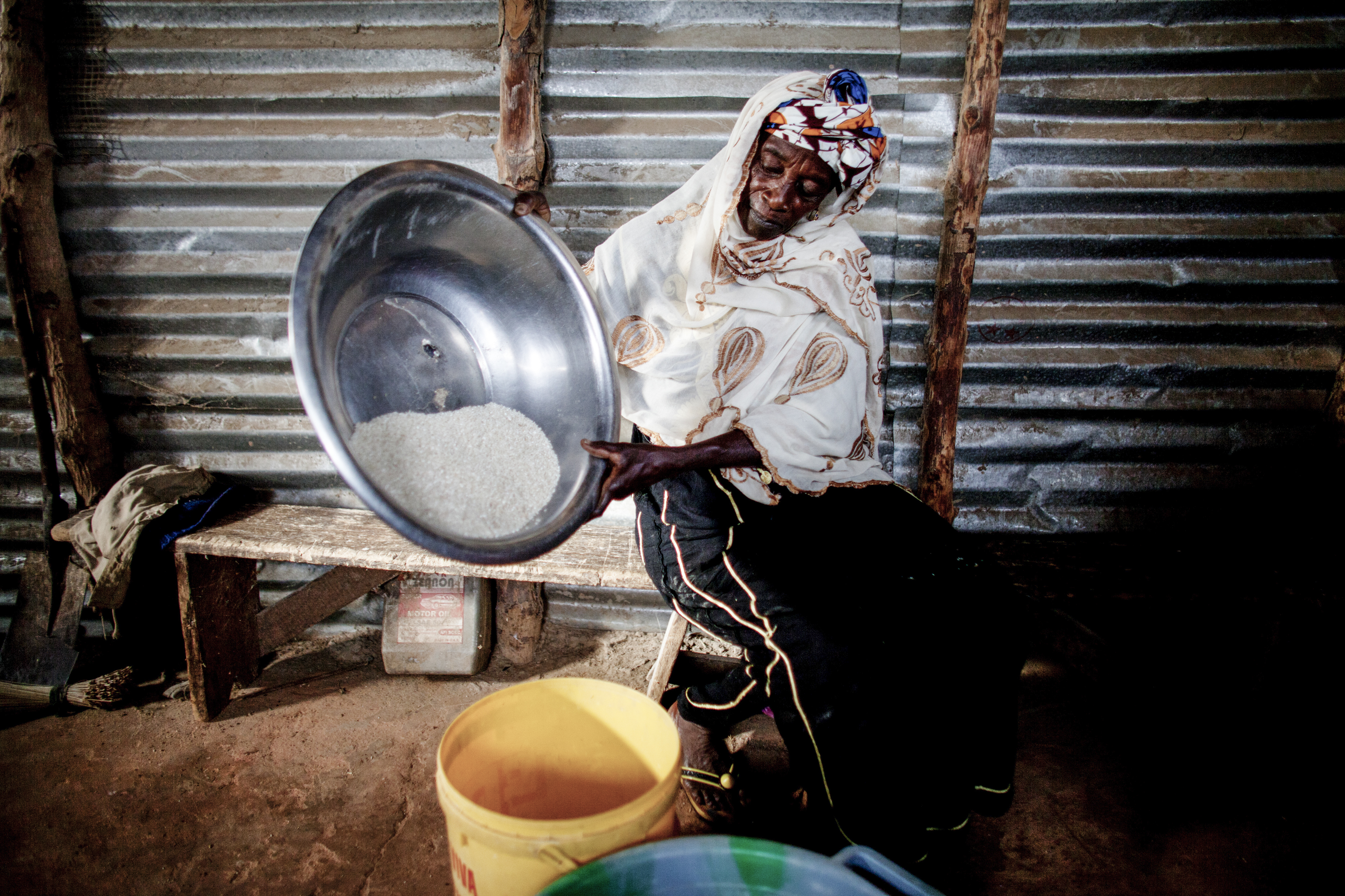 Women are now still bringing rice to be milled in August (the 'hungry season') - evidence that the dyke is working. © Jane Hahn / ActionAid