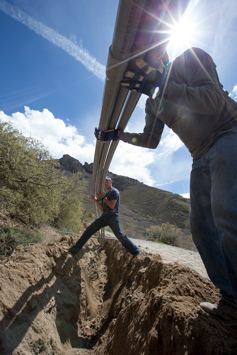 Laying conduit for electrical wiring for Y mountain lighting project - Photo by Mark A. Philbrick/BYU