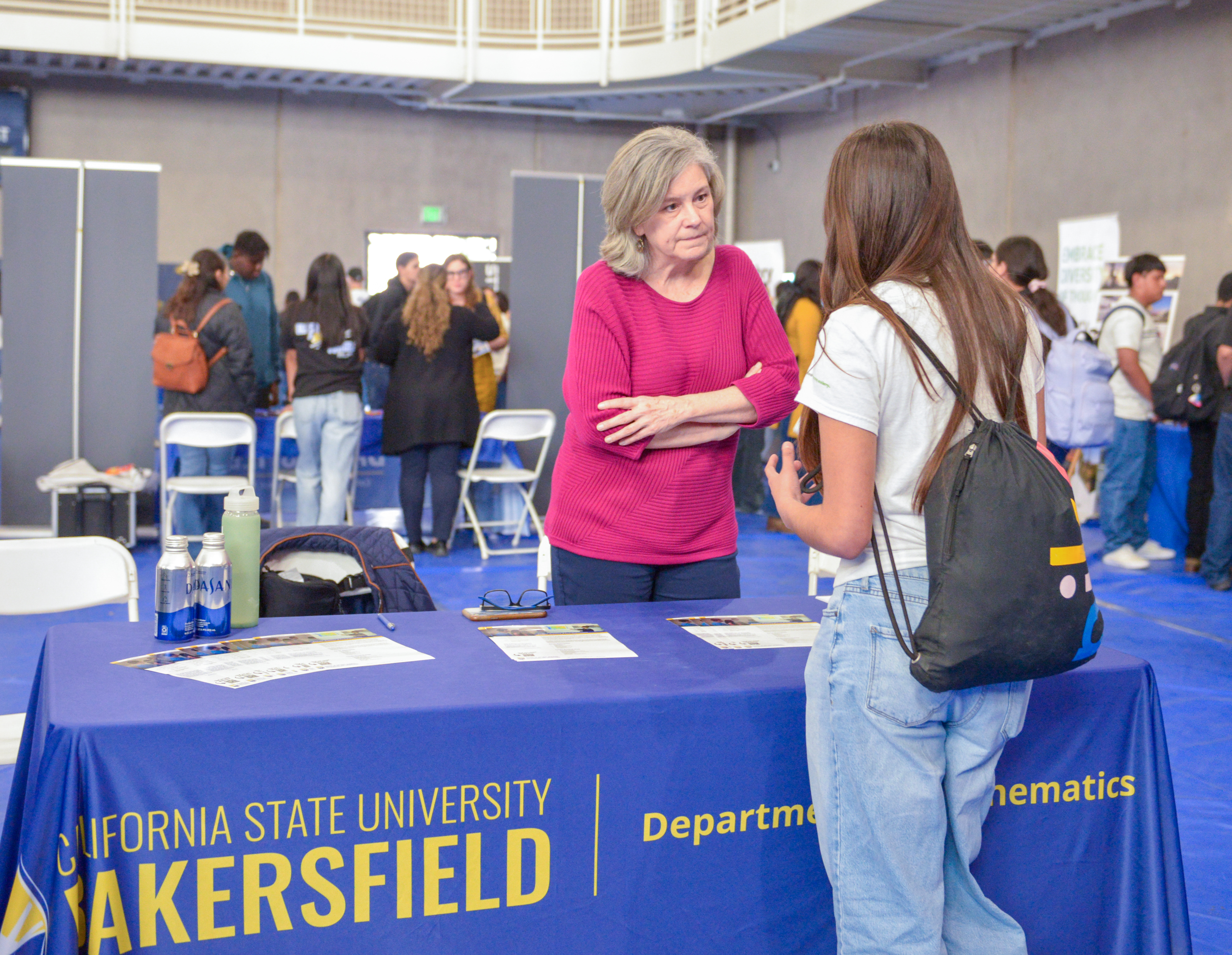 CSUB Chair of Mathematics Dr. Maureen Rush speaks with a student. The ...