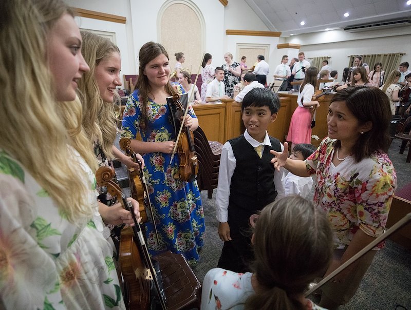 Members meet with BYU students after a fireside at the Aurora Chapel in Quezon City. Photo by Jaren Wilkey/BYU