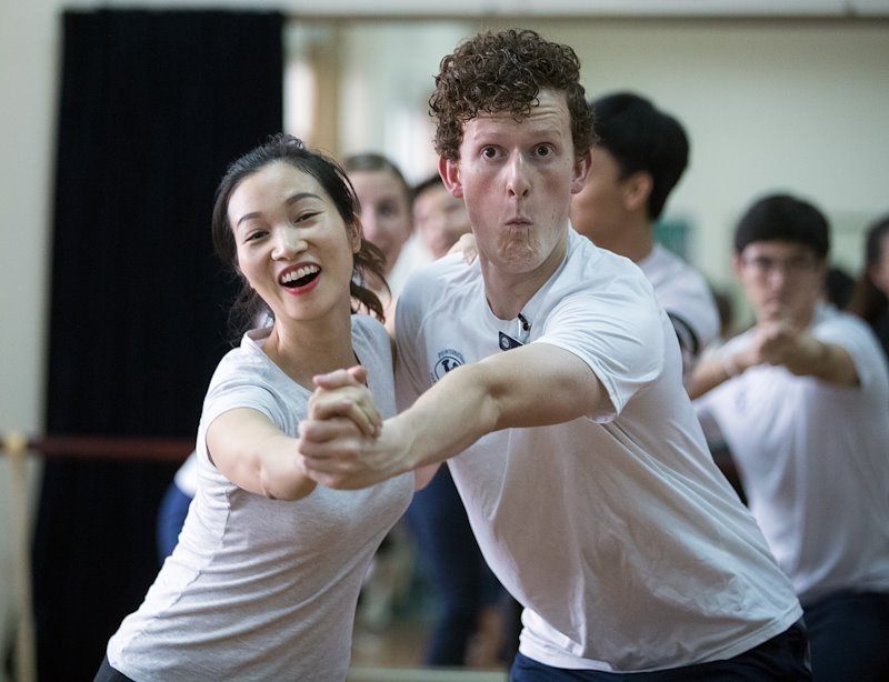 Brandon Carter teaches the finer points of the Charleston at the Hanoi Academy of Theatre &amp; Cinema. Photo by Jaren Wilkey/BYU