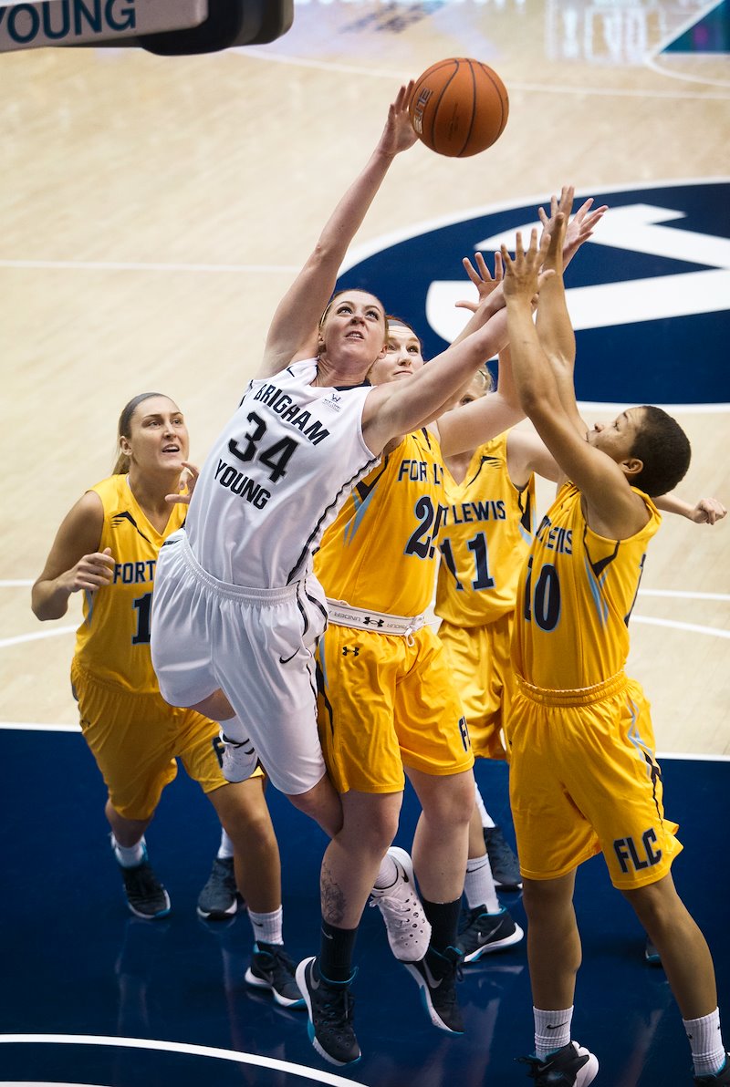BYU's Micaelee Orton goes for a rebound against Ft. Lewis College - Photo by Meagan Larsen/BYU