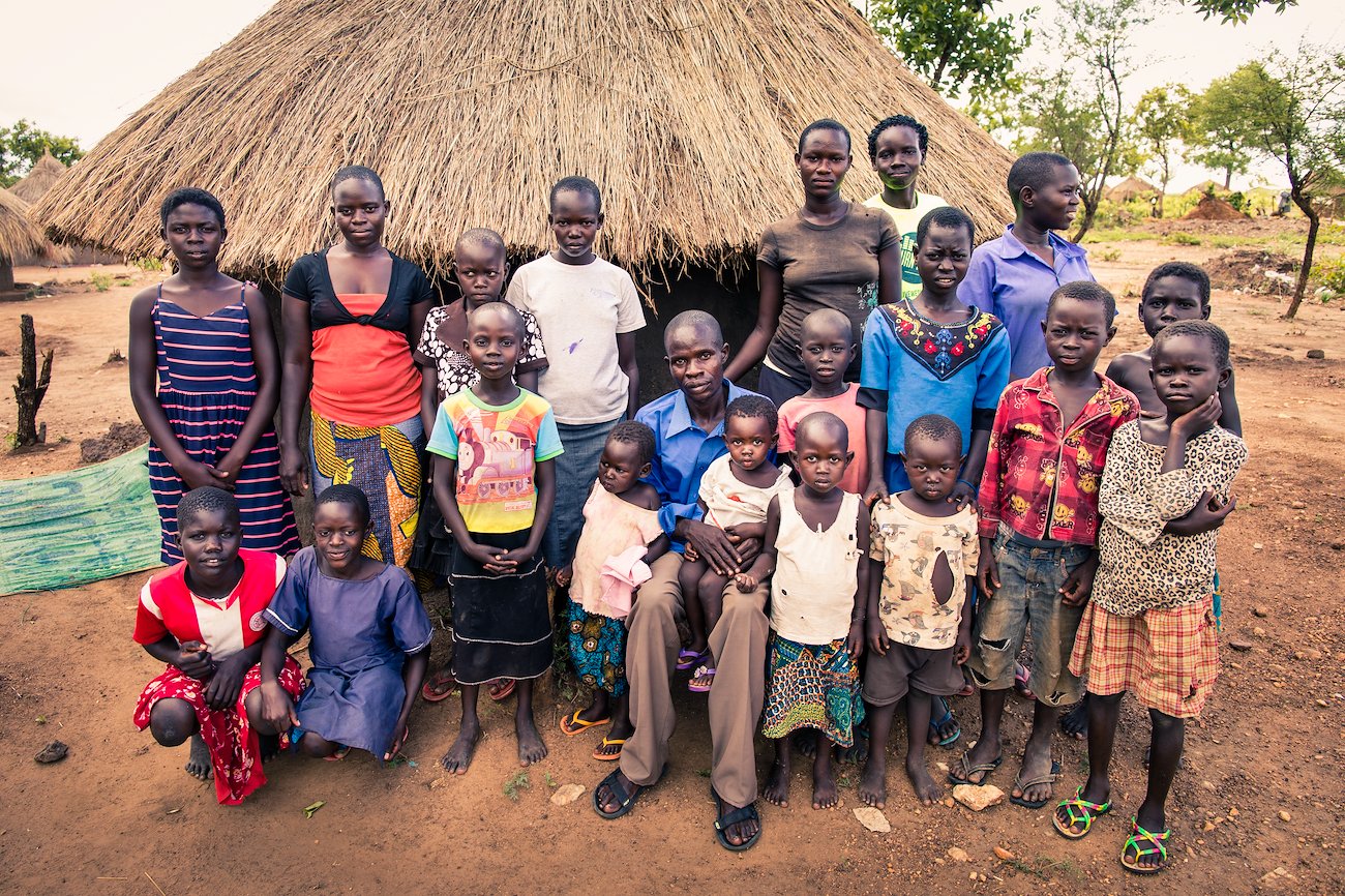 Victor and his extended family. His wife Rose is in the neon green t-shirt in the back row.