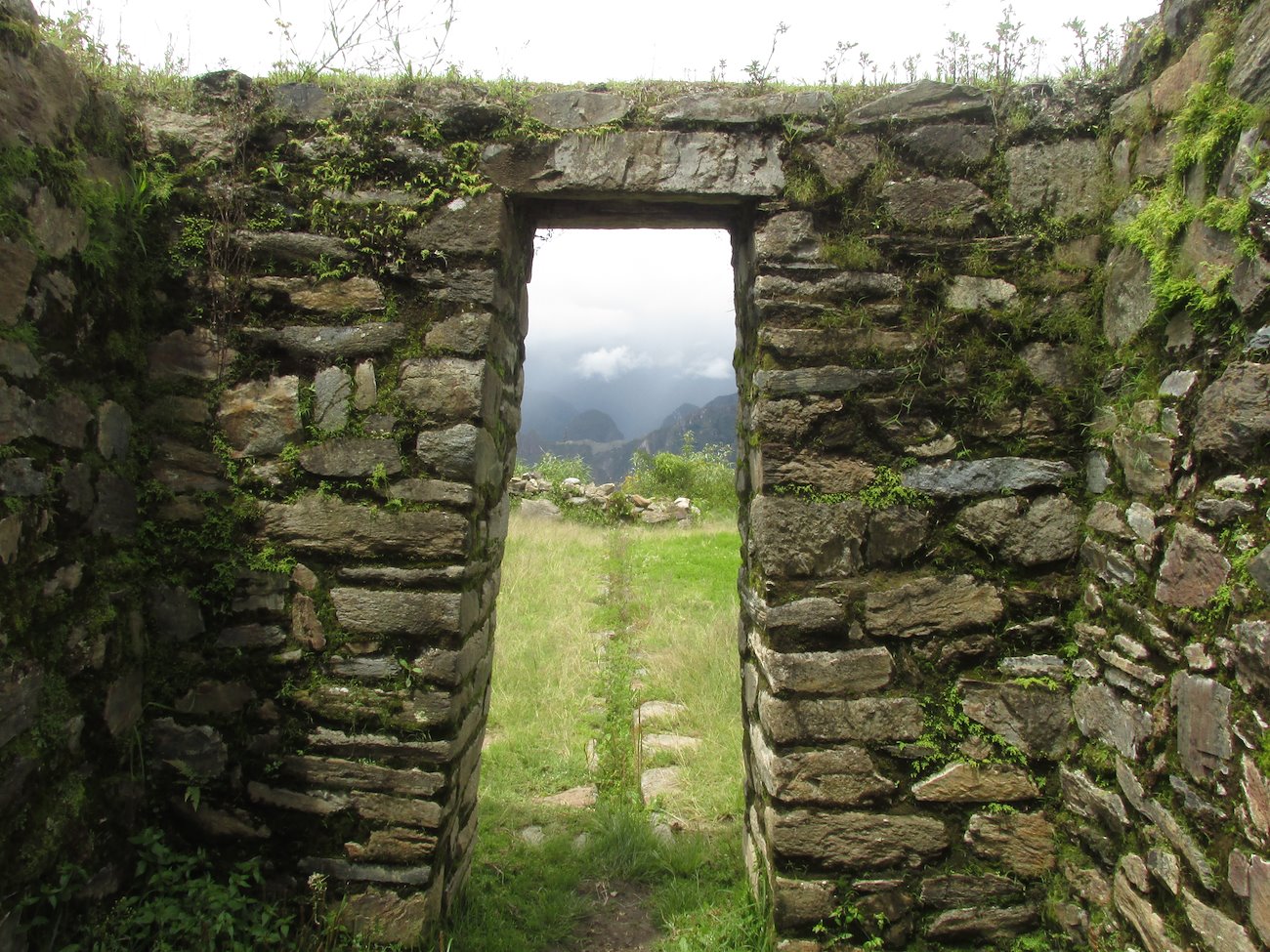 This door way with an irrigation canal cut in front of it points directly to Machu Picchu