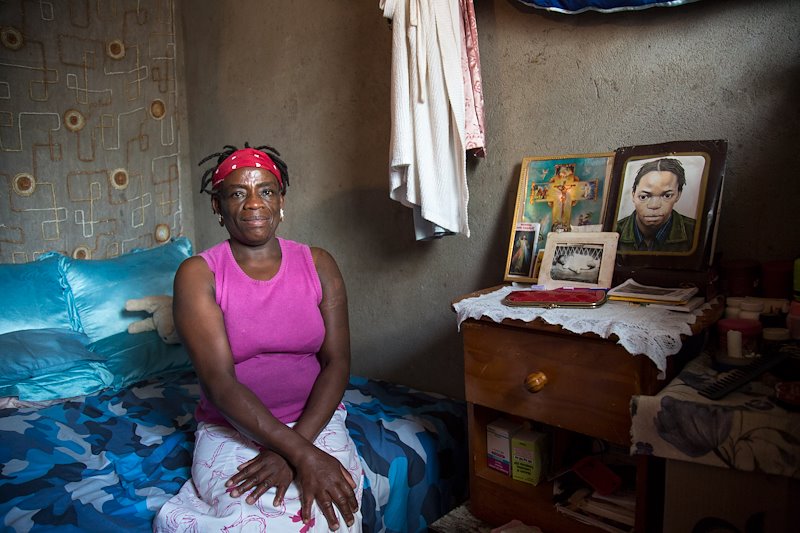 Sarah sits for a portrait in her room in Old Mabvuku, in Harare, Zimbabwe. Sarah has been on ART since 2001.