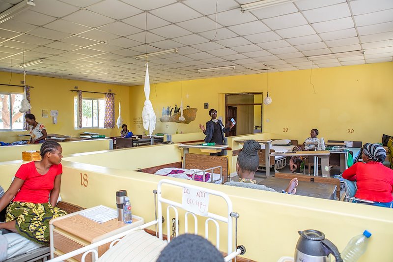 Rev. Na keeps the ward fellowship going while the patients stay in their beds.