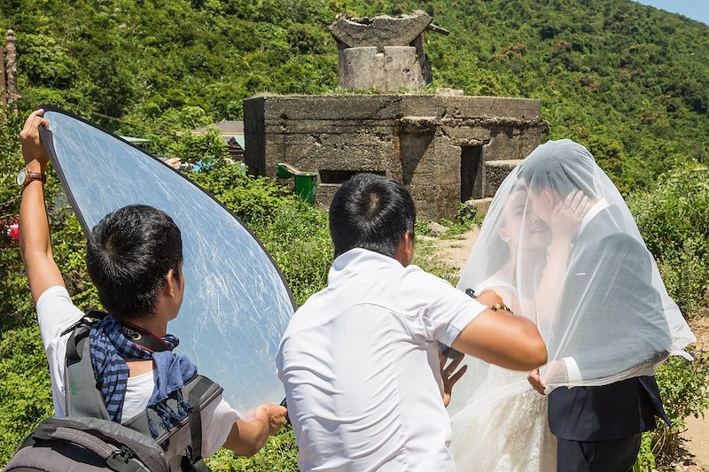At a peak in the mountain pass, we see outposts from the Vietnam war which, to me, seem like an odd backdrop for wedding photos.