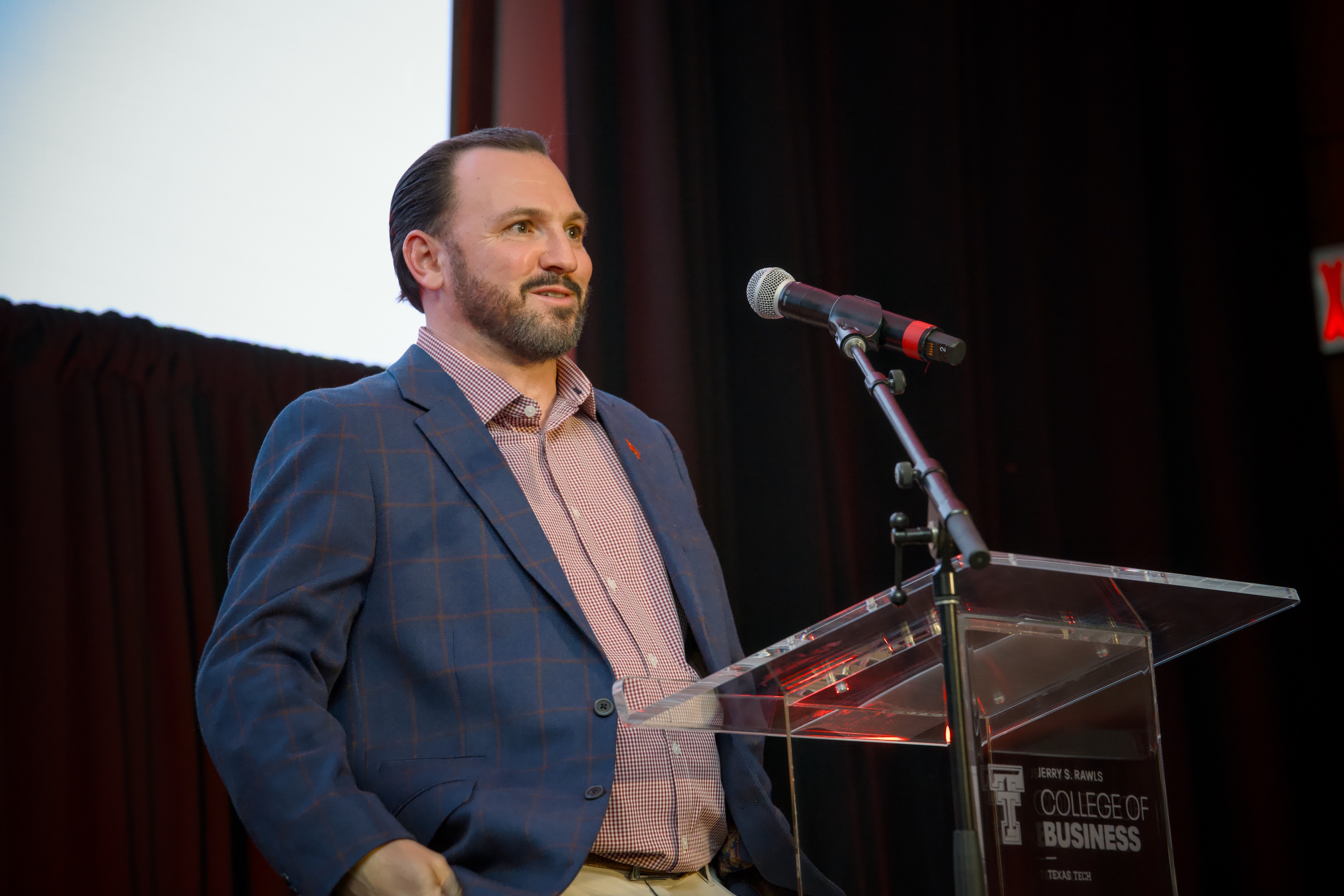 Kevin Hunstable, a 2008 Rawls College of Business graduate, speaks at a ...