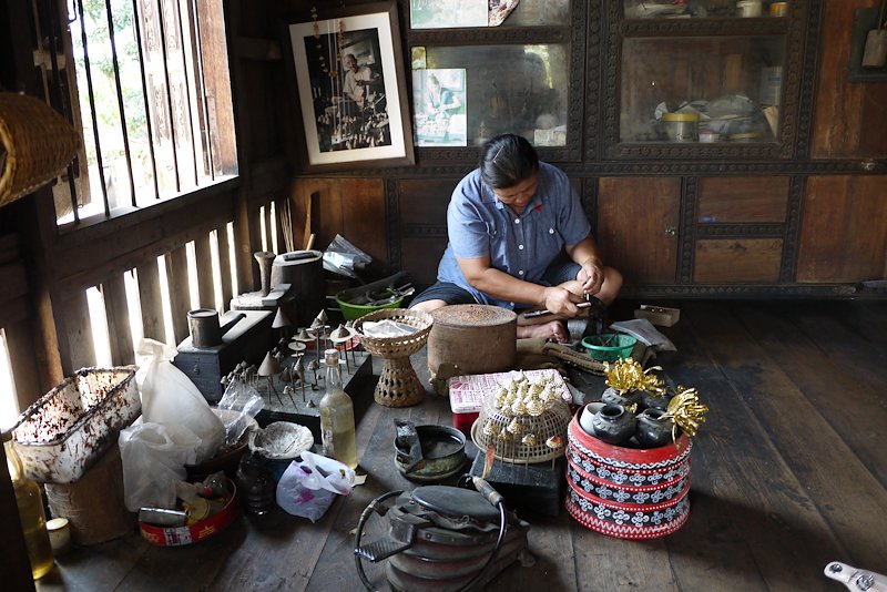 An artisan working on traditional metal works in Mae Chaem, Chiang Mai Province.