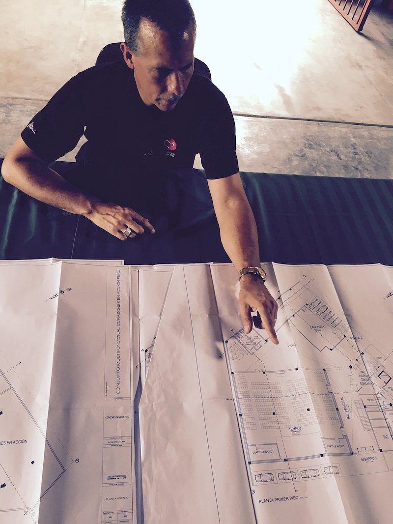 Tom & the architectural plans.jpg