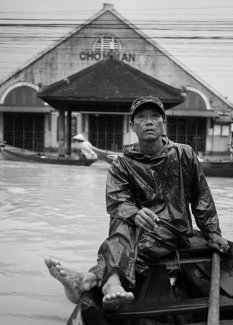 A 'Canoe Captain' with the flooded market hall in the background.