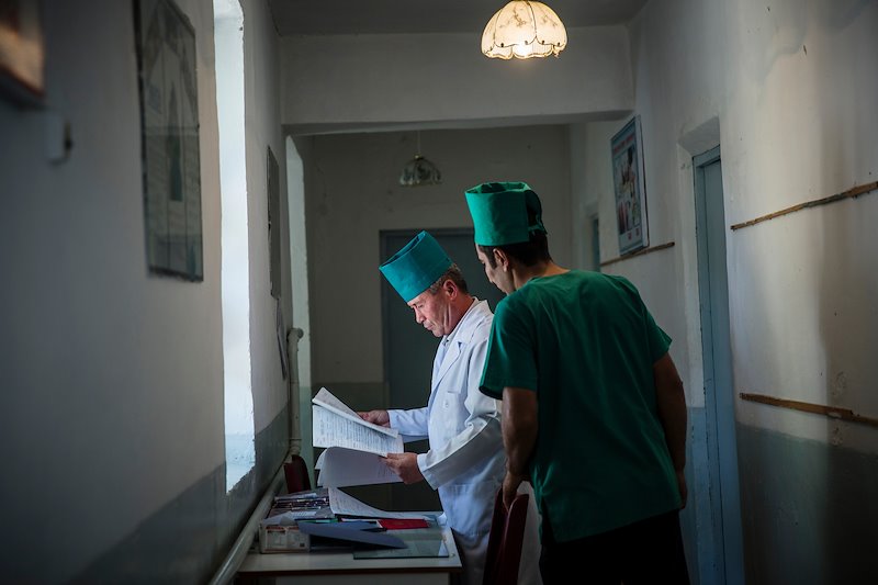 Doctors Abid Madaliev, left, and Asadzhon Polvonov at a village medical clinic.