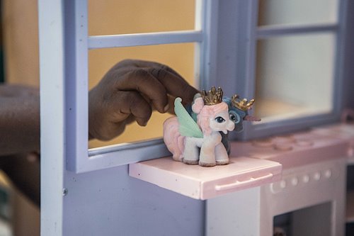 Patients playing with unicorns in the playroom.