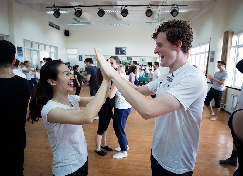 Brandon Carter celebrates with a dancer from the Hanoi Academy of Theatre &amp; Cinema. Photo by Jaren Wilkey/BYU